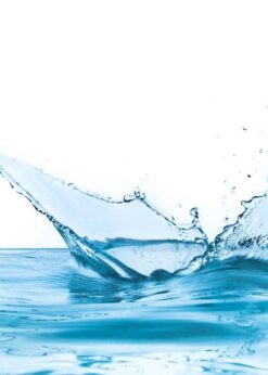 A splash of water creating droplets in a clear blue water surface.